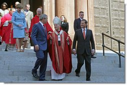 President George Bush walks out of St. Matthew's Cathedral with Theodore Cardinal McCarrick and Supreme Court Chief Justice John Roberts after attending the 52nd Annual Red Mass in Washington, DC, Sunday, October 2, 2005. The Red Mass, a historical tradition within the Catholic Church, is held on the Sunday before the opening session of the Supreme Court. White House photo by Shealah Craighead