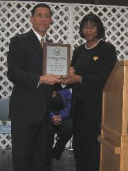 Photo of Maryland Lieutenant Governor Anthony Brown receiving the National President's Challenge award from Council member Dr. Lillian Greene-Chamberlain