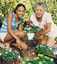 Teen helping an elderly lady in the garden