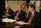 President George W. Bush is joined by Secretary of Energy Samuel Bodman, left, and FEMA Administrator David Paulison, right, as he speaks to the press from the Roosevelt Room following a briefing on the latest developments concerning Hurricane Ike, Sunday, Sept. 14, 2008. White House photo by Chris Greenberg