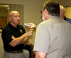 Congressman Kevin Brady visits with OC Emergency Management Coordinator Jeff Kelley Tuesday at the Command Center in downtown Orange.  Brady rode through his district checking on how evacuations went.  It's not over for emergency management as they now have to coordinate getting the special needs people back to Orange County, which is set to begin on Thursday.