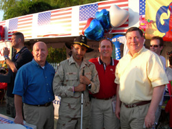 Congressman Brady attends July 4 festivities with wounded U.S. soldier from the Afghanistan front Kenny Adams. 