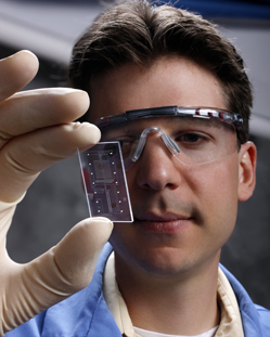 Thomas Perroud examines a MICA chip