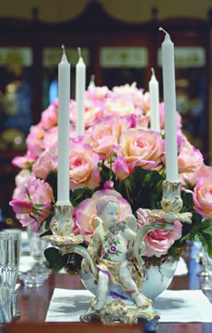    In the dining room du Pont carefully coordinated flowers, candleholders, and dishes for his lavish dinner parties. His floral aesthetic was precise: multiple arrangements of one type of bloom or one color.   
—Courtesy, Winterthur Archives     