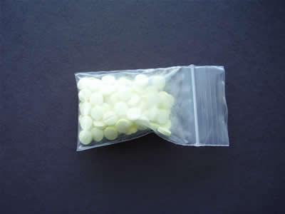 Plastic bag containing yellow Haloperidol tablets as received by consumers