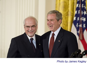 NEH Chairman Bruce Cole (left) receives Presidential Citizens Medal from President George W. Bush