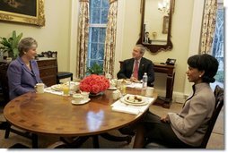 President George W. Bush meets with Karen Hughes and Secretary of State Condoleezza Rice for breakfast in the President's private dining room at the White House Monday, March 14, 2005. Secretary Rice announced today that Karen Hughes will be nominated as Under Secretary of State for Public Diplomacy and Public Affairs.  White House photo by Krisanne Johnson