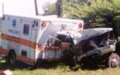 Type I ambulance at employer’s vehicle yard after recovery from crash site.