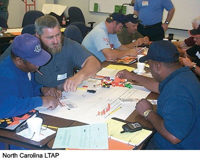 These transportation workers are engaged in a tabletop exercise on work zone safety, hosted by the North Carolina LTAP.