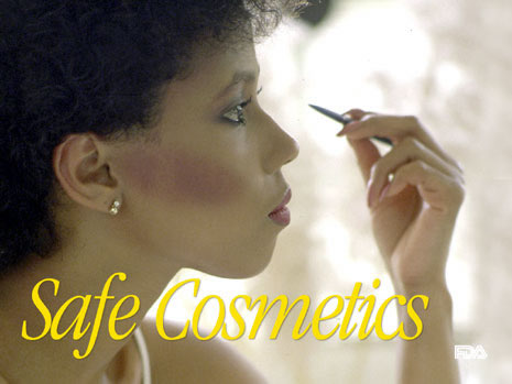 Slide with picture of a woman putting on make-up and the words: Safe Cosmetics.