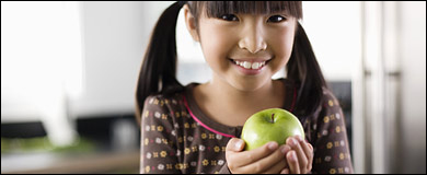 Photo: A girl with an apple
