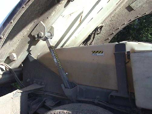 Figure 5. Hopper support safety bar in “In Use” position.