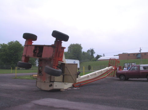 Figure 2. The aerial work platform tipped over during the incident and hit a pickup truck that was parked near by.