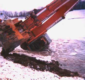Figure 1. Excavator as being lifted from the water in gravel pit.