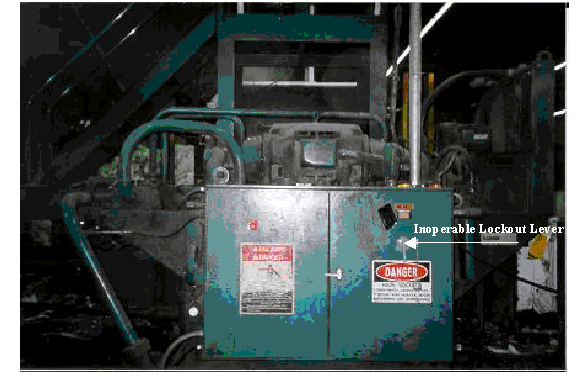 baler power panel, arrow points 
to inoperable lockout lever