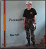 Photo Thumbnail: LT Jill Shugart, an Environmental Health Officer, analyzes flood water depths during a school inspection in El Higurel, Guatemala.