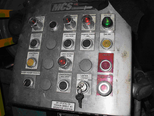 Photo 2.  The control panel with lockout switch and line jog button at #3 bridle roll set of the tinning line.