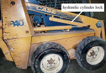 Photo 4 – Hydraulic cylinder lock in stowed position.
