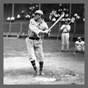 A baseball player swinging a bat at home plate.