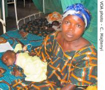 Majtenyi mother and her baby wait for treatment for the babys severe malaria 