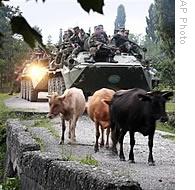 Russian troops ride atop armored vehicles near the village of Khurcha in Georgia's breakaway province of Abkhazia, 10 Aug 2008