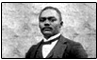 Black and white photo of an African American male dressed in a suit and bow tie. graphic link