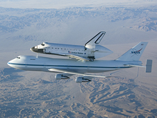 The Space Shuttle Endeavour mounted atop its modified Boeing 747 carrier aircraft flies over California's Mojave Desert on the first leg of its ferry flight back to the Kennedy Space Center on Dec. 10, 2008.