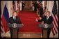 President George W. Bush and Russian President Vladimir Putin appear together at a joint news conference in the East Room of the White House, Friday, Sept. 16, 2005 in Washington, where President Bush thanked Putin for Russia's offers of assistance in the wake of Hurricane Katrina. White House photo by Eric Draper