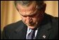 President George W. Bush prays during the National Prayer Breakfast in Washington, D.C., Thursday, Feb. 5, 2004. White House photo by Eric Draper.