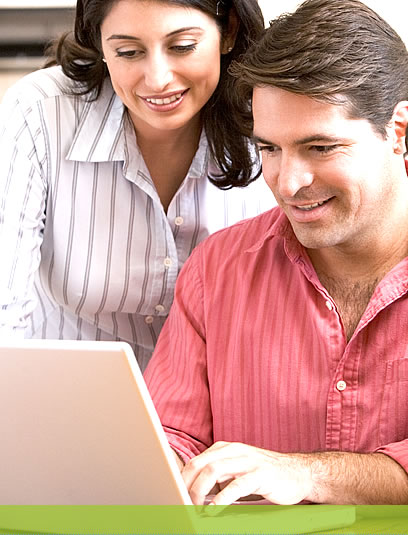 News Center: Photo of a man and a woman viewing a laptop