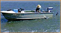 angler in boat on lake