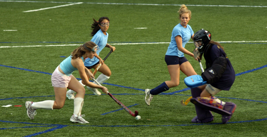 Girls playing lacrosse.