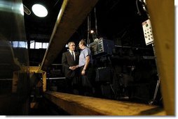 President George W. Bush greets employee Bill Haines during a tour of the Central Aluminum Company in Columbus, Ohio, Thursday, Oct. 30, 2003. "Congress needs to pass a sound energy plan to help deal with the issues that confront this good company, Central Aluminum," said President Bush during his remarks on energy at the company.  White House photo by Eric Draper