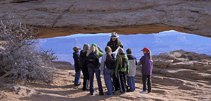 A local school group visits Mesa Arch at the Island in the Sky