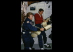 STS-40 (SLS-1) astronauts reviewing crew procedures inflight