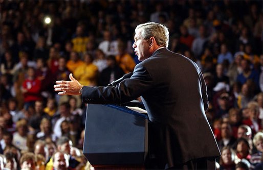 Welcomed by a crowd of more than 4000 people, President George W. Bush addresses the cheering audience at Northern State University in Aberdeen, S.D., Oct. 31. White House photo by Tina Hager.