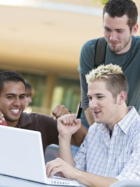 3 college guys playing computer games