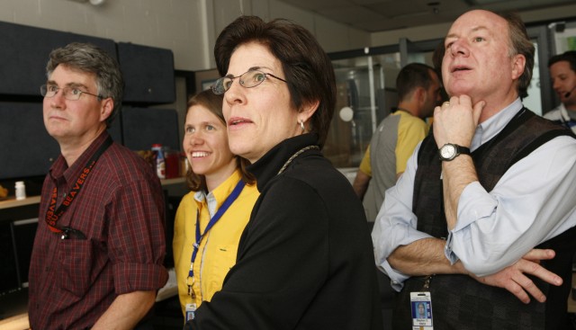 Delight shows on the faces of Scott H. Robinson, far left; Kimberly Katko, left; Diana Esch-Mosher, right; and Steve Knox, far right, as they watch from the Lab's Satellite Operations Center at SM-40 as the Cibola Flight Experiment launches.