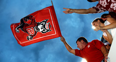 Wolfpack Club member waves his flag in support of the football team during an ACC game in Carter-Finley Stadium.