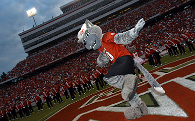 NC State mascot on the field at a football game
