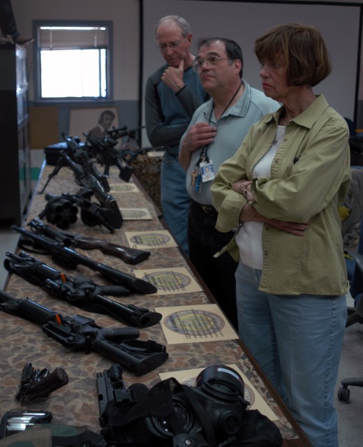 Los Alamos County Councilors Mike Wheeler, Ken Milder and Nona Bowman listen to a presentation about the different weapons that Protection Technology Los Alamos security forces are proficient on during a recent demonstration at Technical Area 72 of PTLA's manpower and equipment capabilities. County councilors Jim West, Jim Hall and Mike Wismer also attended the prenentation.