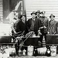 Sheriff John N. Farlaw and his men with confiscated still, ca. 1922, Salisbury, MD