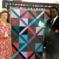 Representative from Uganda being presented with an Olympic Quilt, 1996