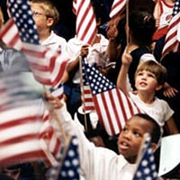 Kids wave flags at Library Day