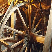 Wooden gear, 24' in diameter, used to create pressurized air in the blowing tubs
