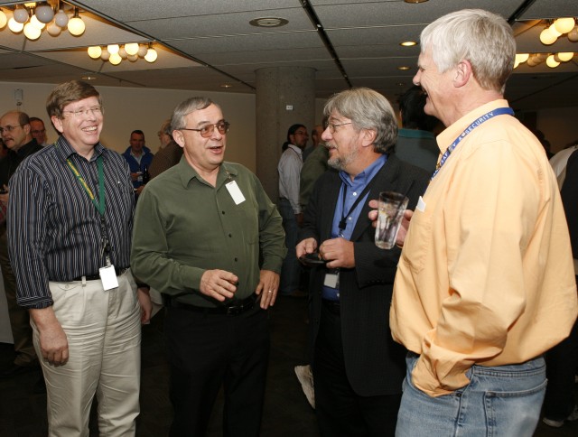 Laboratory Director Michael Anastasio talks with Manuel Vigil, center, of High Performance Computing, Roadrunner project manager, Terry Wallace, principal associate director for science, technology, and engineering, and Andy White, right, of Theory, Simulation, and Computation, Roadrunner project director, at a reception last week. 