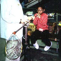 Millville Elementary student blows a glass bubble, 1999