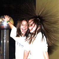 Two girls doing experiment with static electricity at LSC