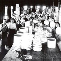 Finished hatboxes are piled high in the Schiffenhaus plant, 1899