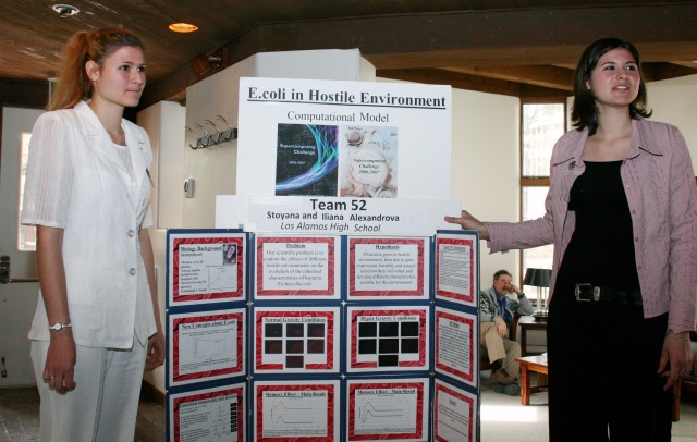 Iliana Alexandrova, left, and her sister, Stoyana Alexandrova, talk about their research project during the judging portion of the Supercomputing Challenge on Monday at University House. Their project won second place in the competition.